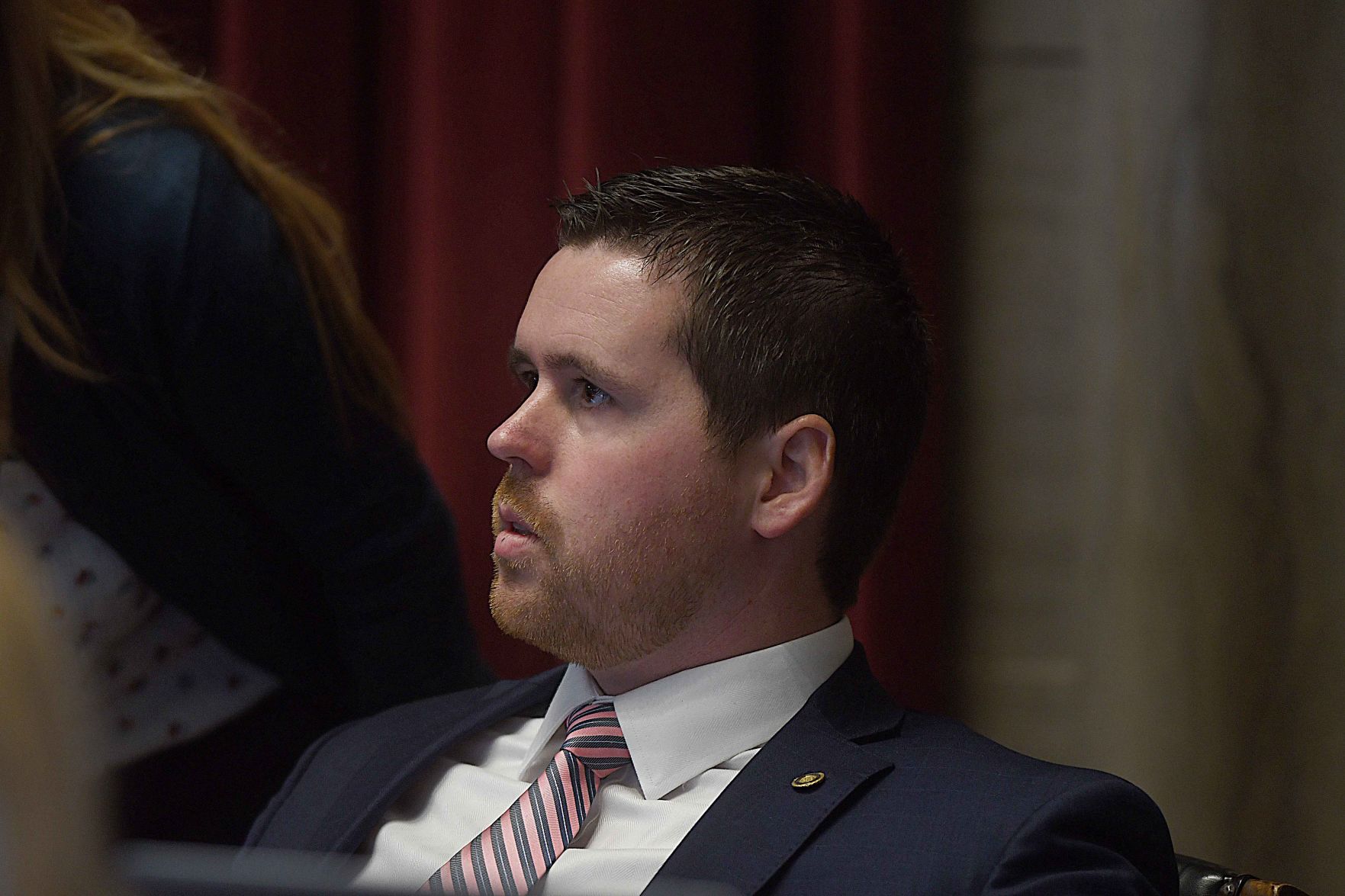 Rep. Scott Fitzpatrick listens as lawmakers discuss a bill